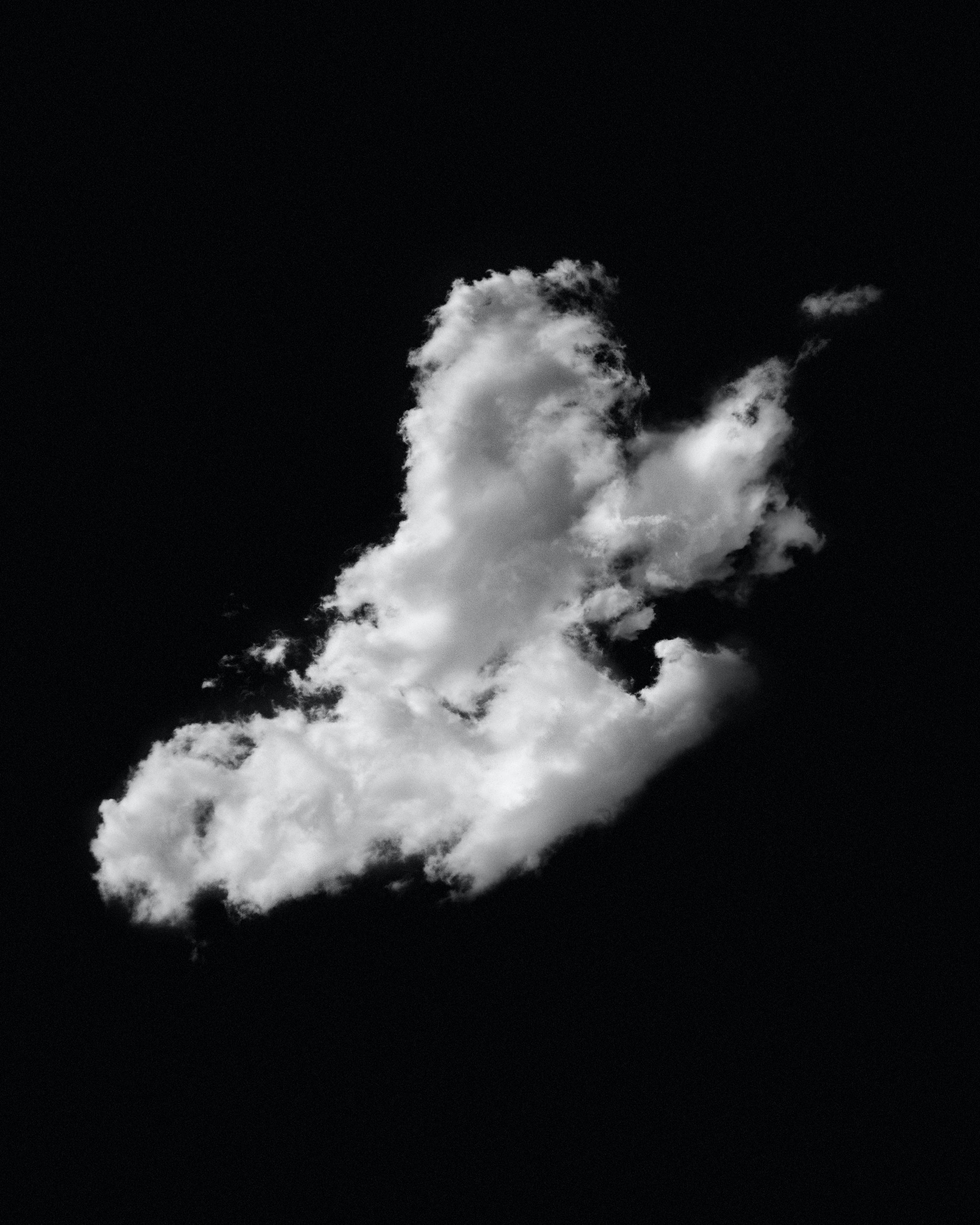 image of a lone cloud on a black background